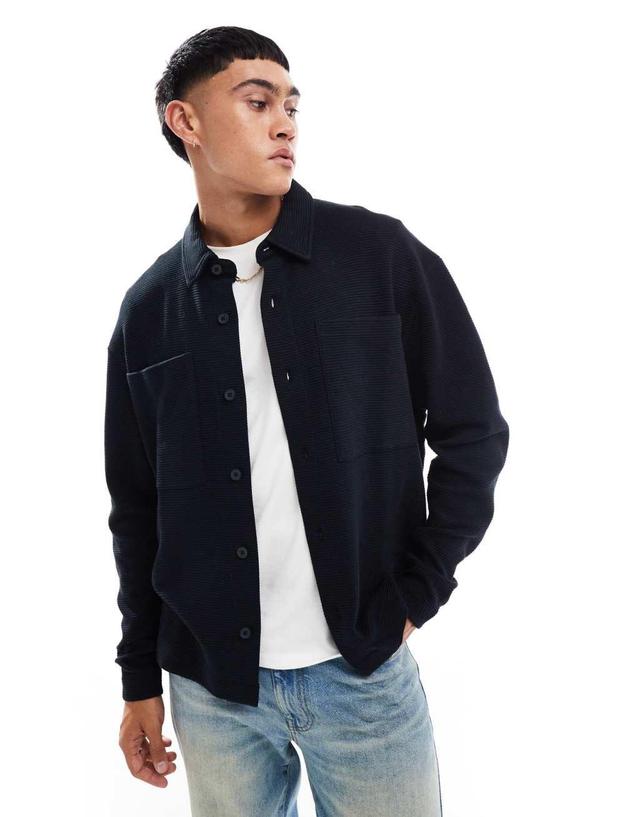 ASOS DESIGN oversized ribbed button through jersey jacket in black Product Image