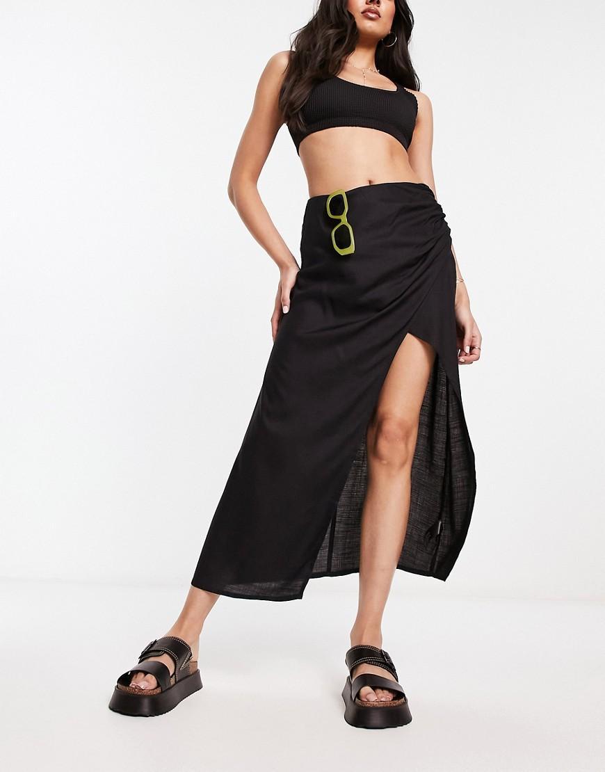 ASOS DESIGN natural slub ruched side midi skirt in black Product Image