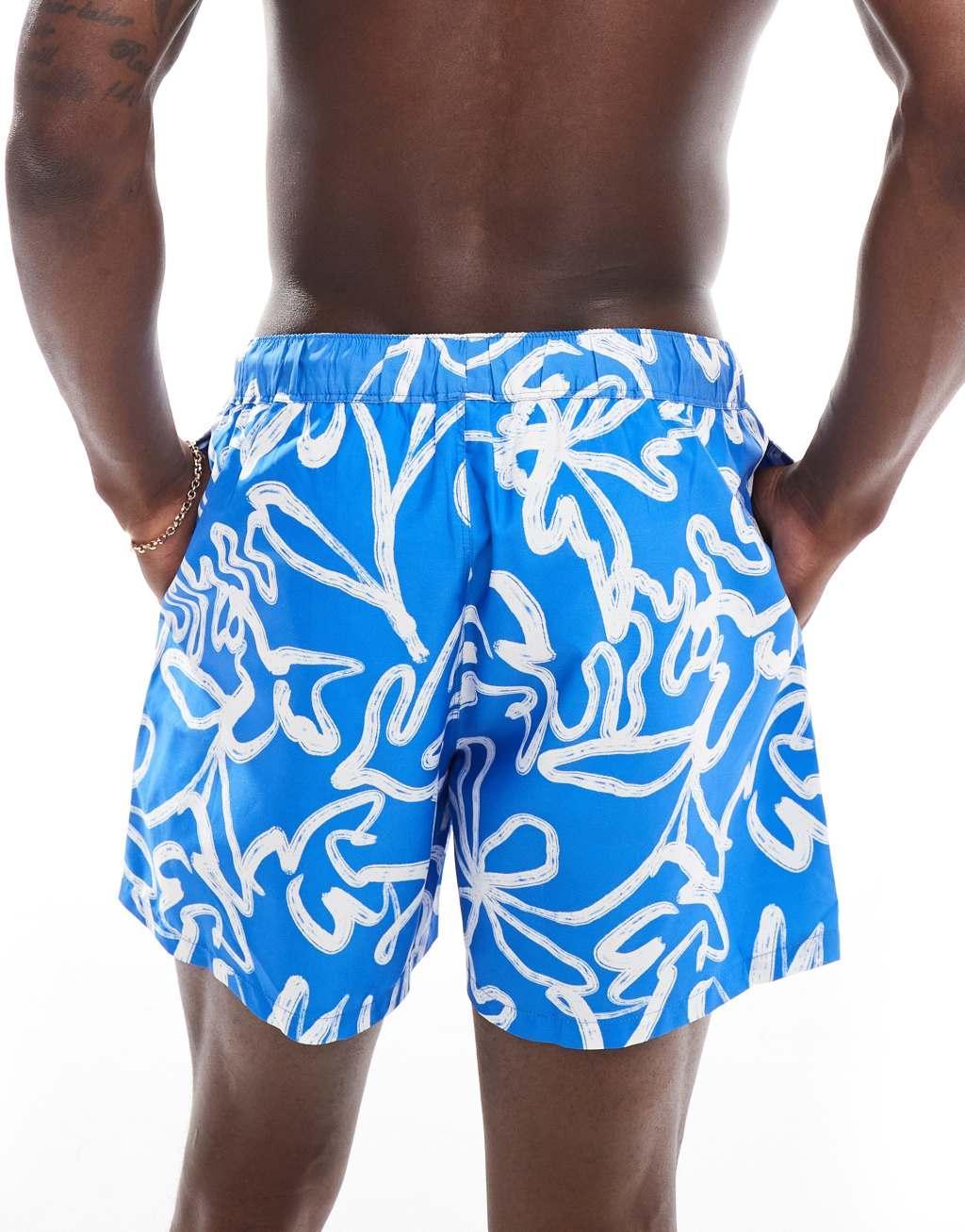 ASOS DESIGN swim shorts in mid length in blue floral print  Product Image