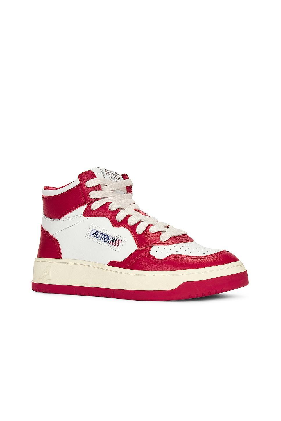 Autry Bicolor Medalist Mid Sneaker in White & Red - Red. Size 38 (also in 36, 37, 39, 41). Product Image