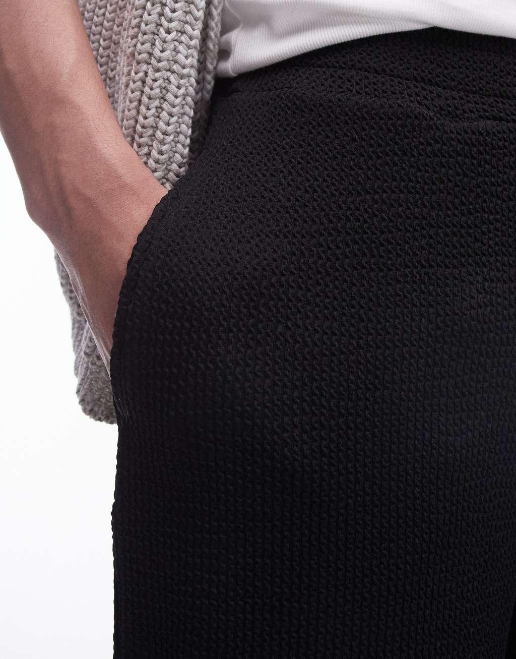 Topman oversized fit jersey shorts with crinkle plisse texture in black Product Image