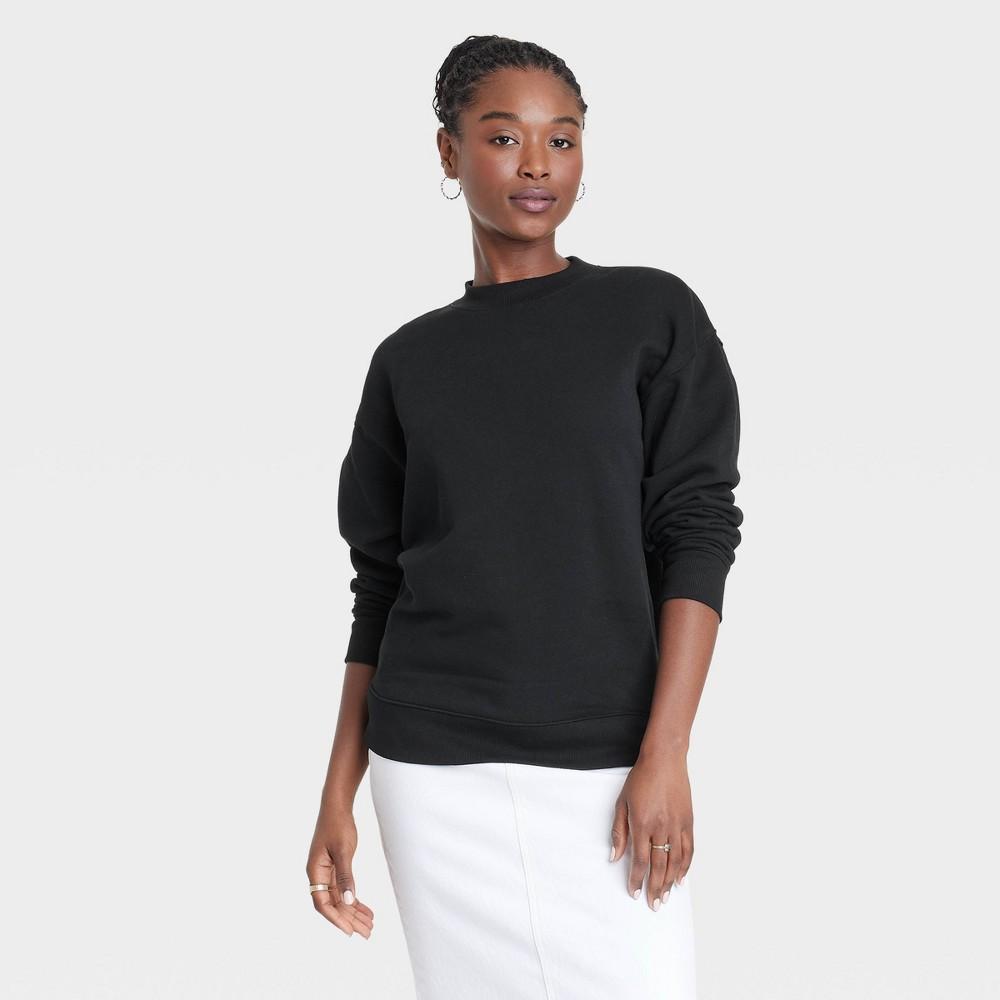 Womens Leisure Studio Oversized Pullover Sweatshirt - Universal Thread Black Product Image