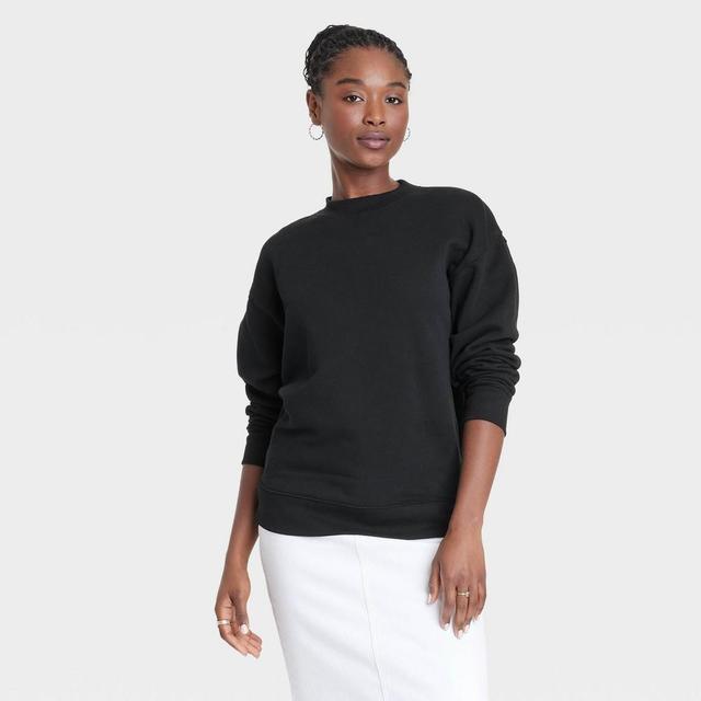 Womens Leisure Studio Oversized Pullover Sweatshirt - Universal Thread Black L Product Image