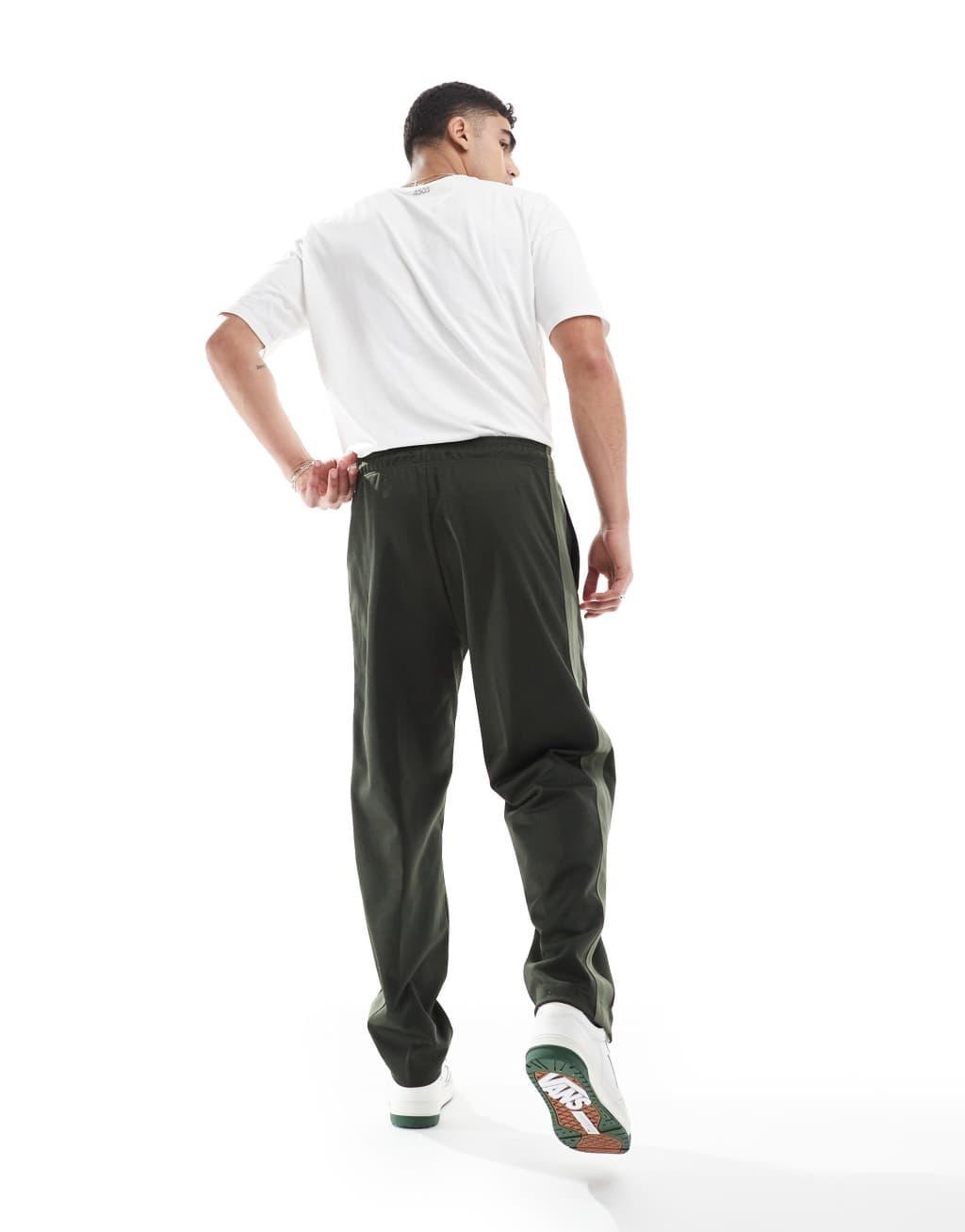 Fred Perry track sweatpants in dark green with taping - part of a set Product Image