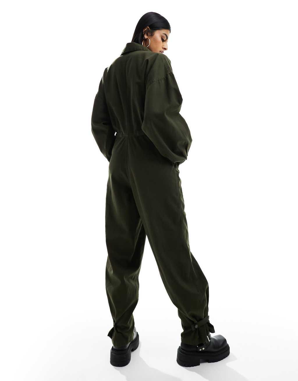 ASOS DESIGN collared boilersuit with button detail leg in khaki Product Image