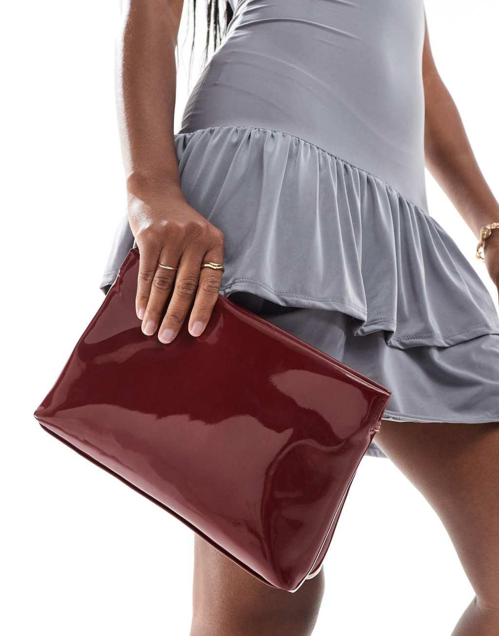 ASOS DESIGN zip top clutch in burgundy Product Image