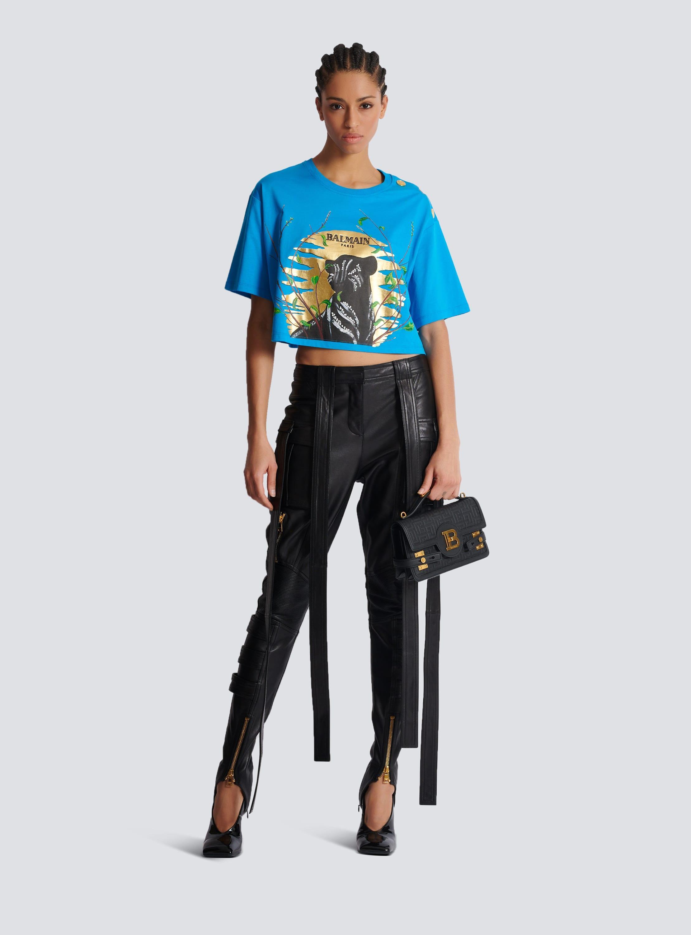 Leather cargo trousers with straps Product Image