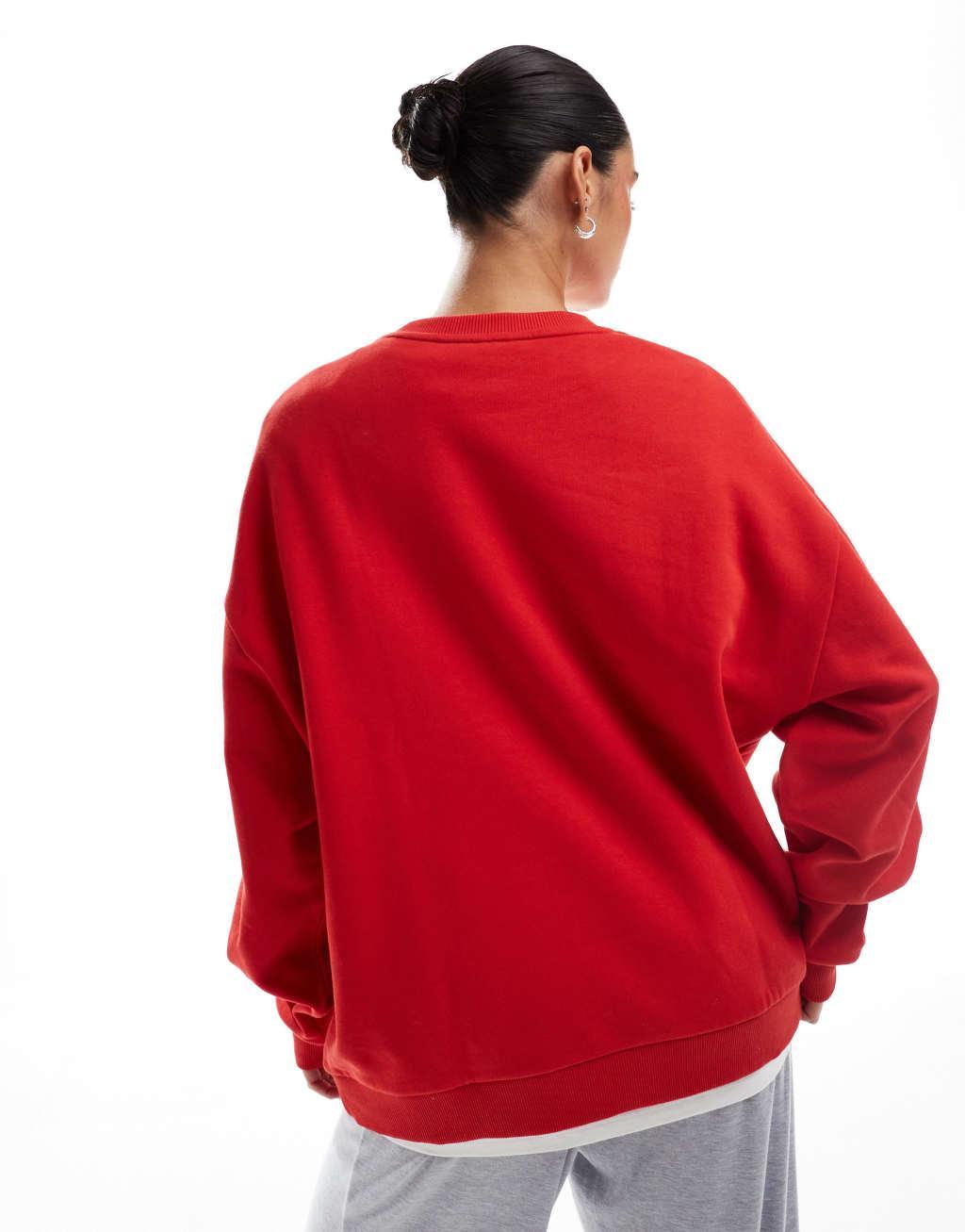 ASOS DESIGN oversized sweatshirt with Manhattan graphic in red Product Image