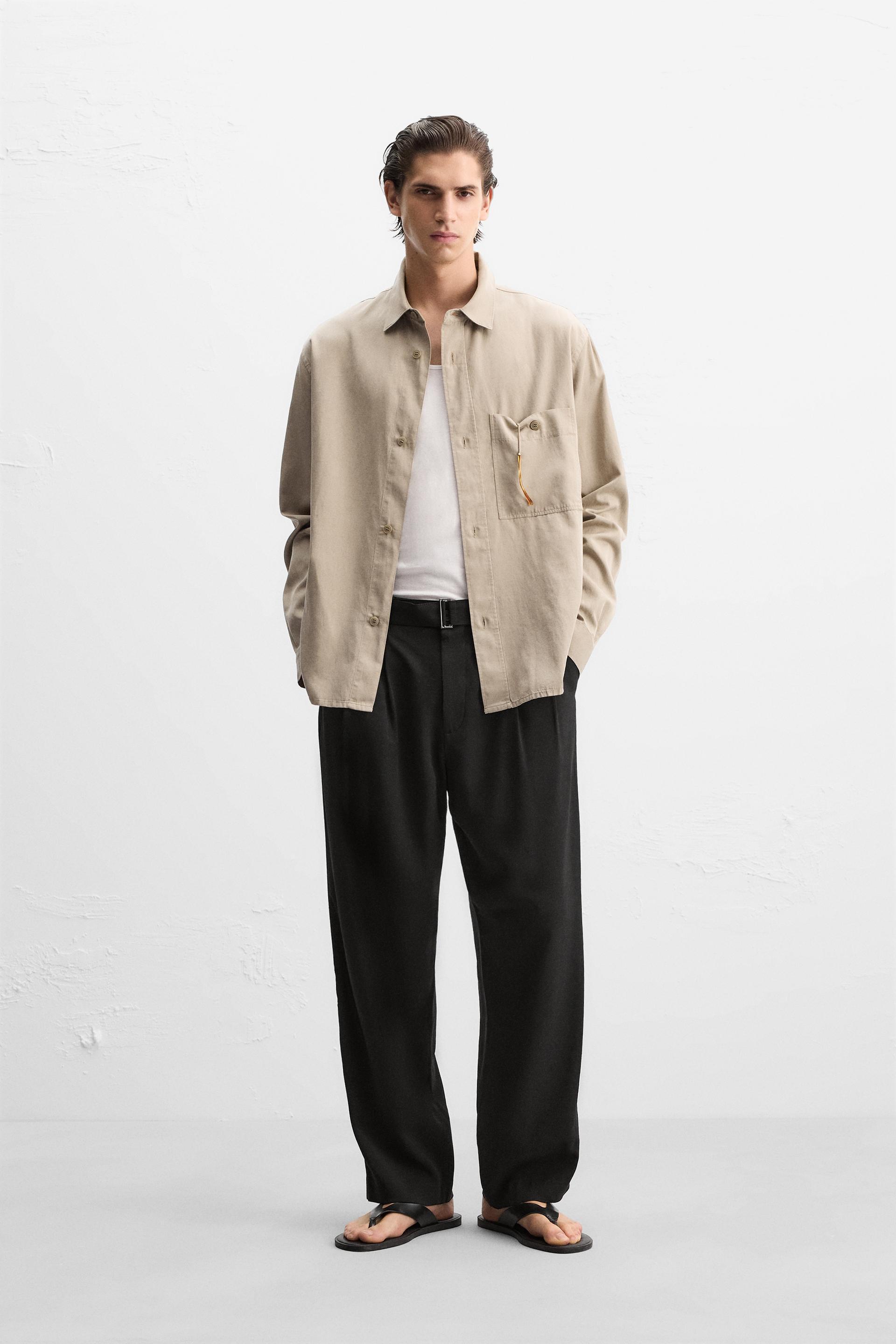 PLEATED PANTS WITH BELT Product Image