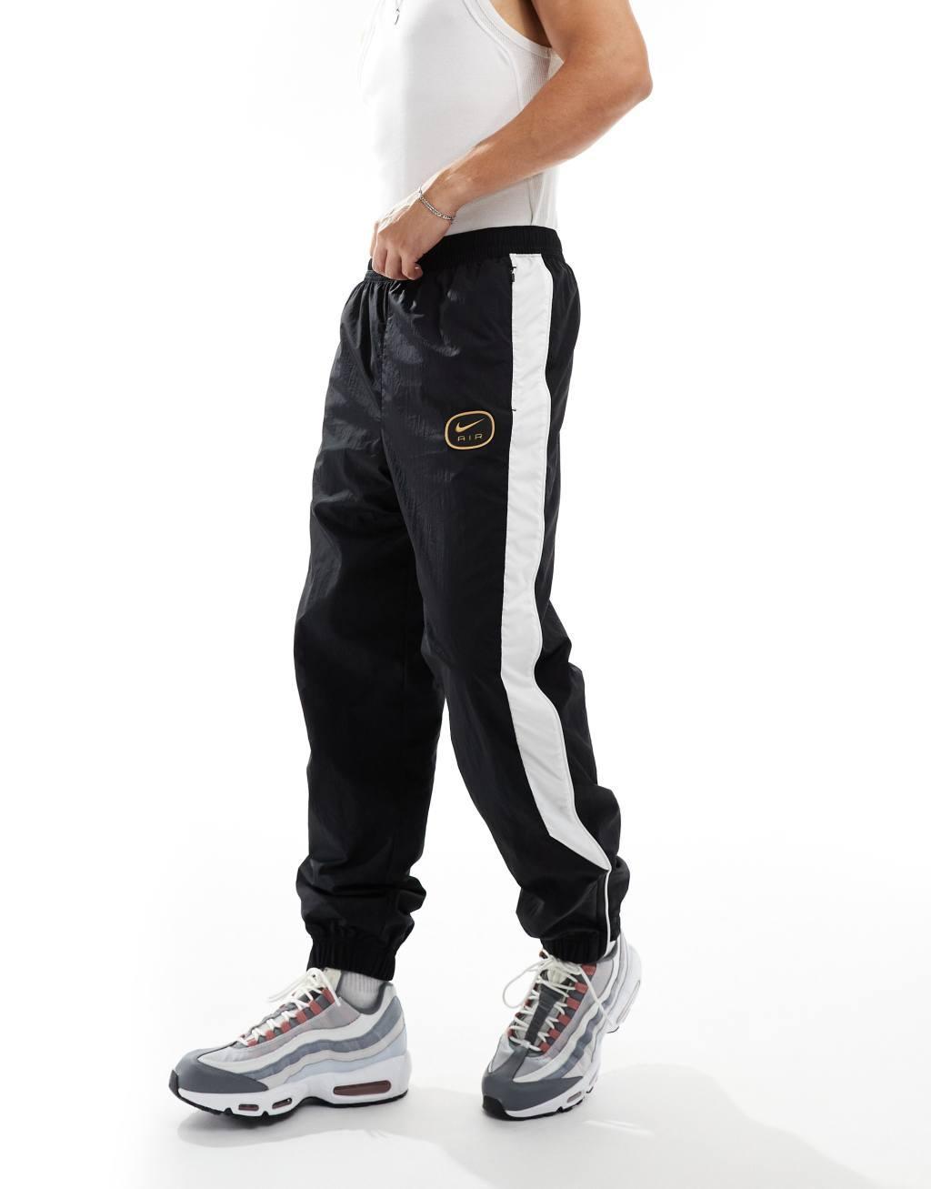 Nike Swoosh Air woven sweatpants in black and white Product Image