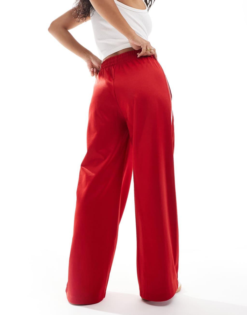 Bershka wide leg piping detail sweatpants in red Product Image