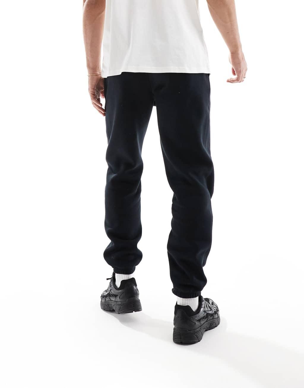 Nike Club chenille logo sweatpants in black Product Image