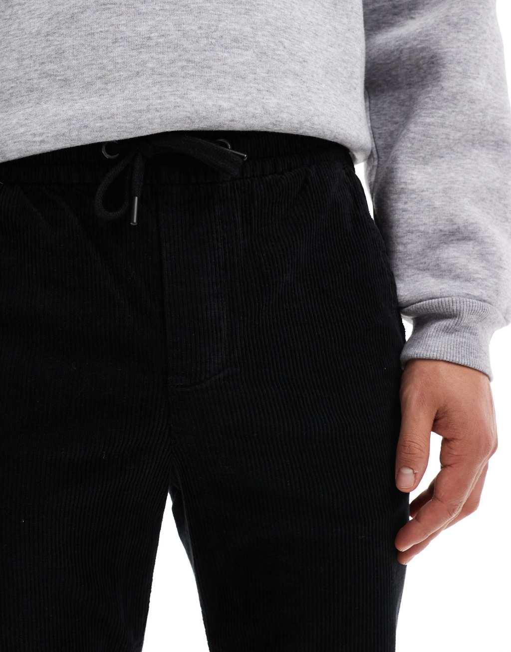 ONLY & SONS tapered corduroy pants in black Product Image