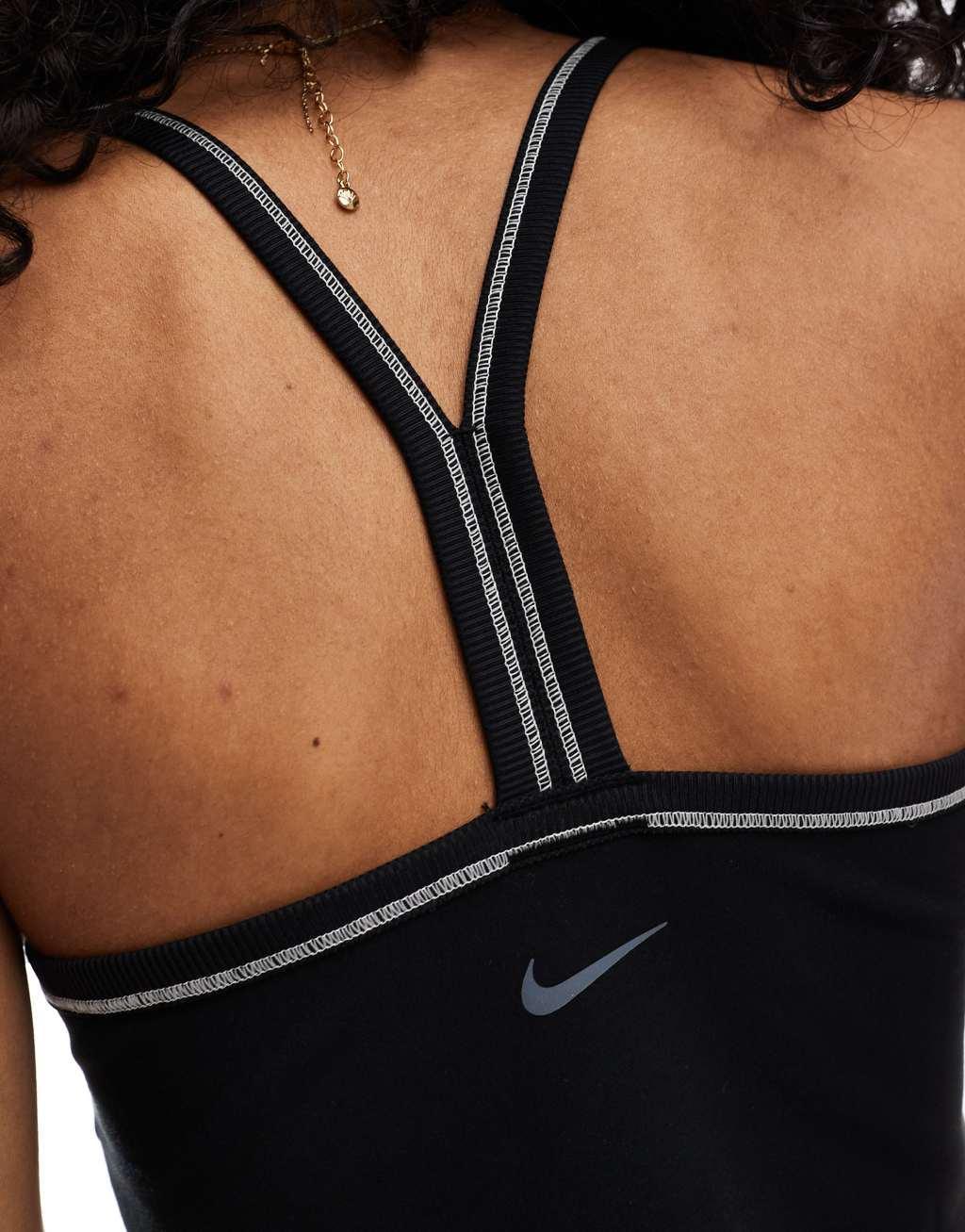 Nike One Training Dri-FIT stitch detail cropped ribbed tank top in black Product Image