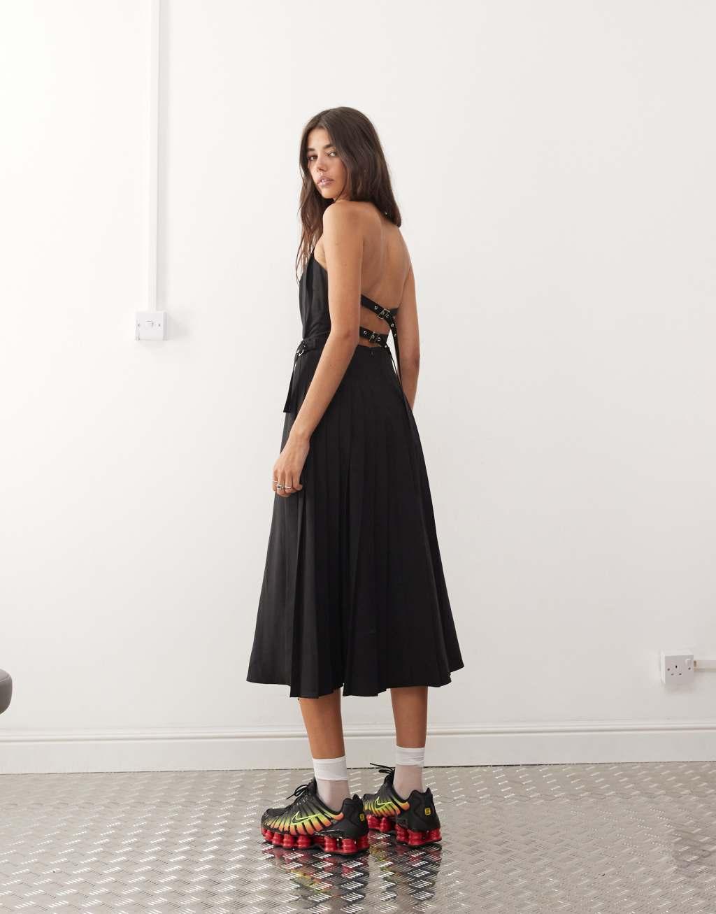 COLLUSION midi pinny dress with pleated hem and hardware detail in black Product Image