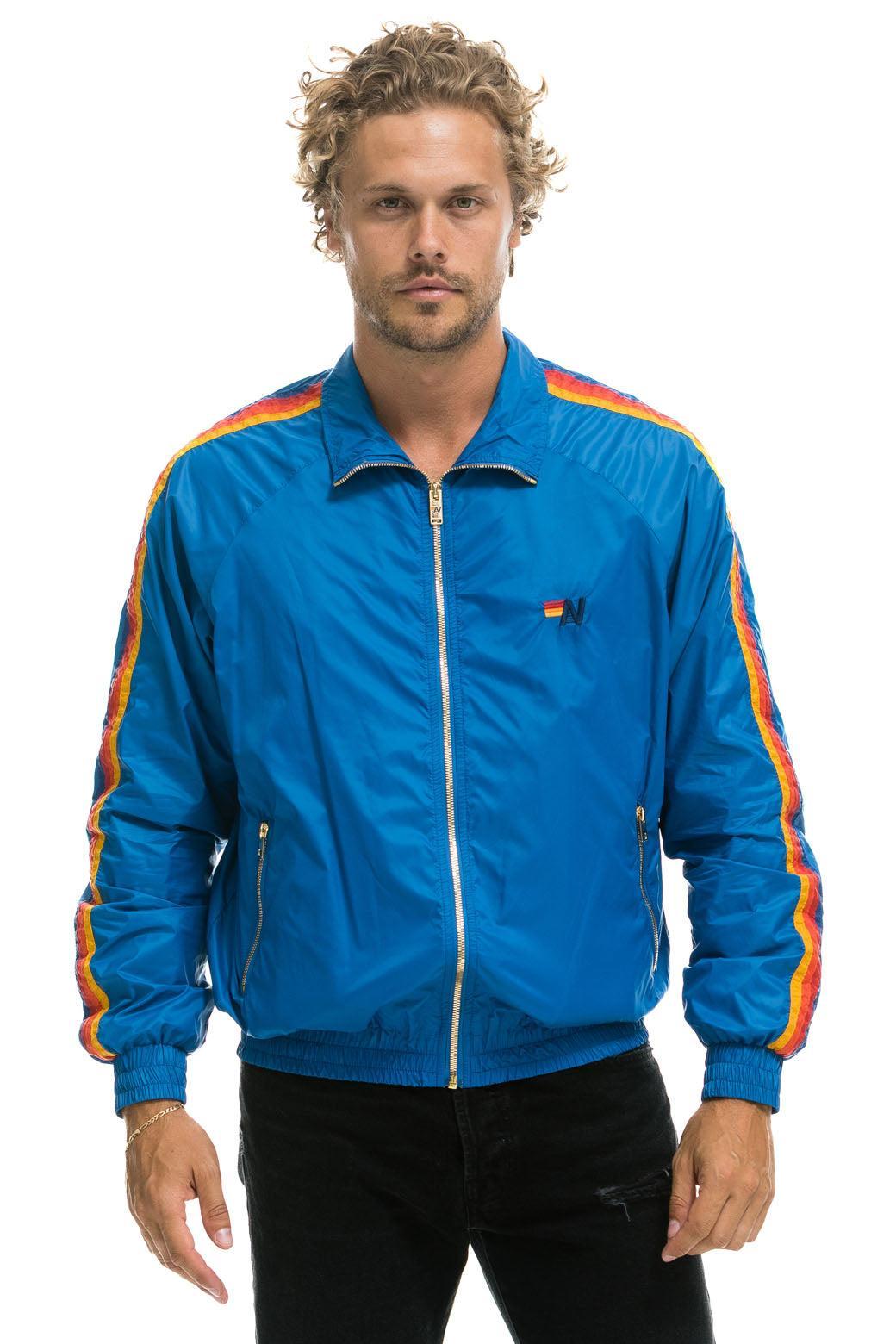 MEN'S 4 STRIPE WINDBREAKER -  SNORKEL BLUE Male Product Image