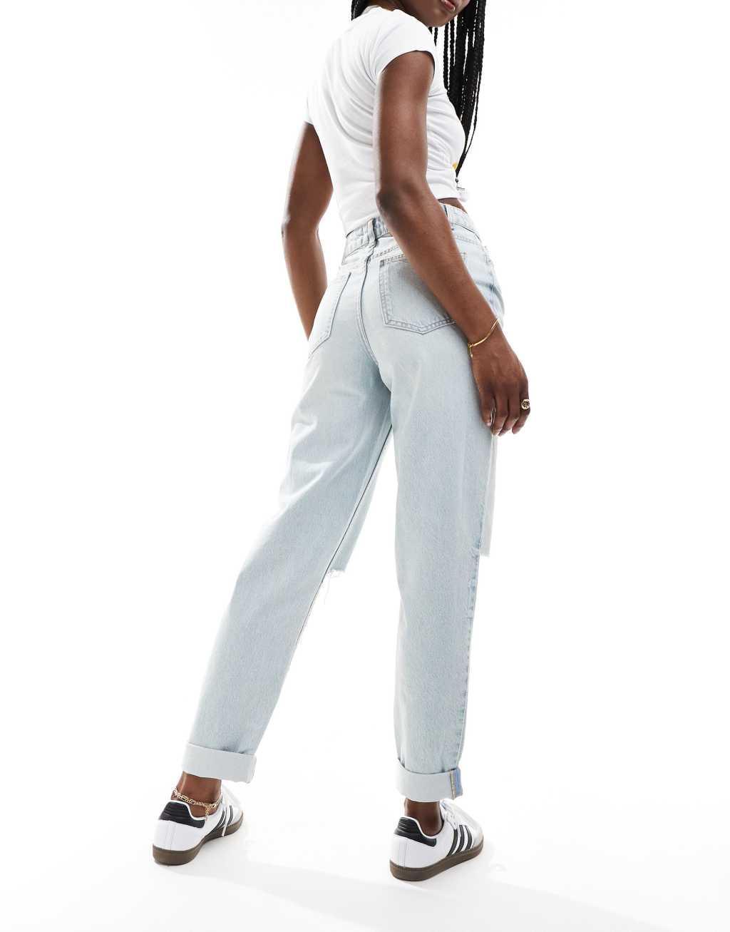 ASOS DESIGN high rise relaxed mom jeans in light blue with rip Product Image