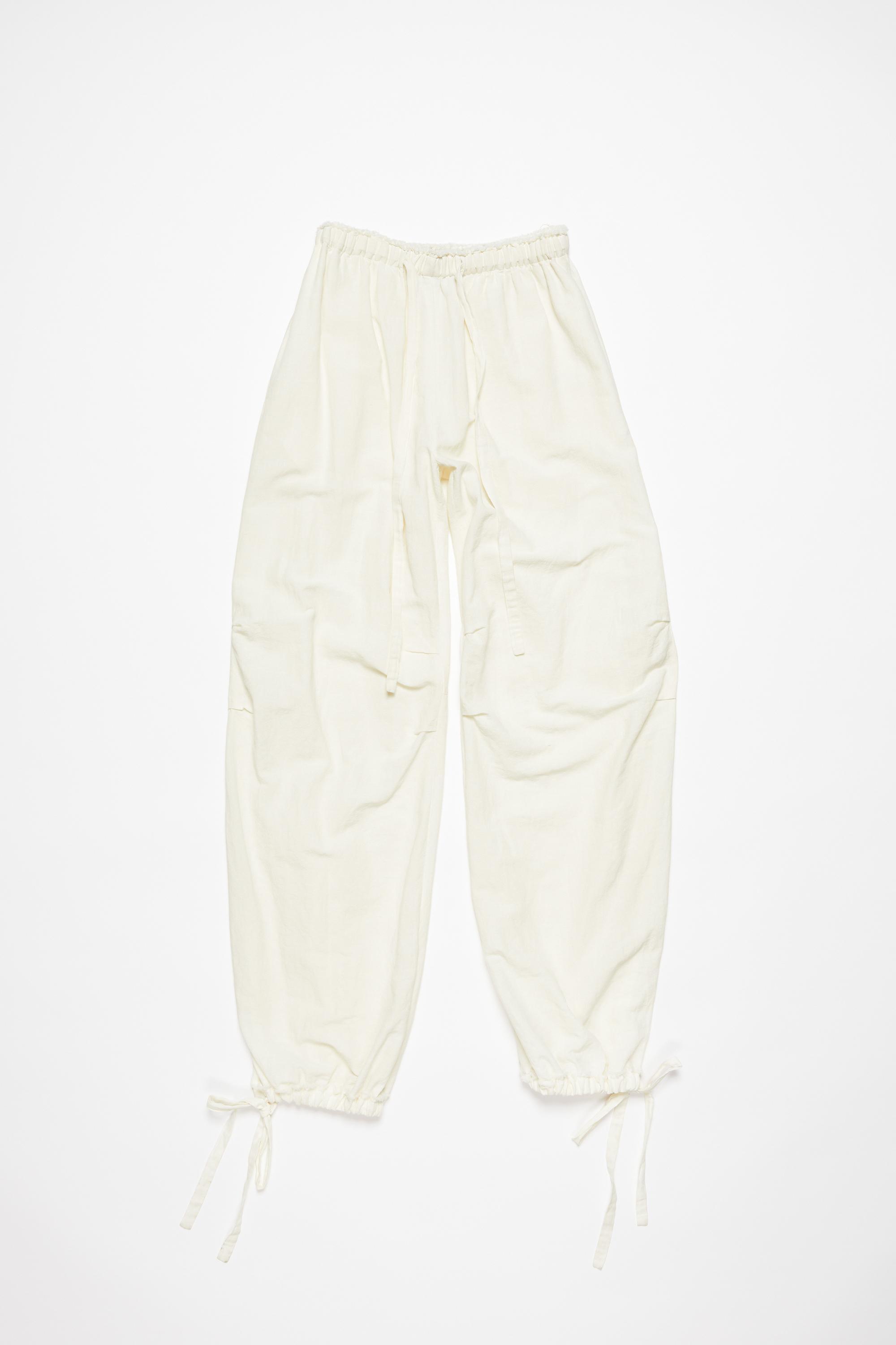 ACNE STUDIOS Relaxed Drawstring Trousers In Warm White Product Image