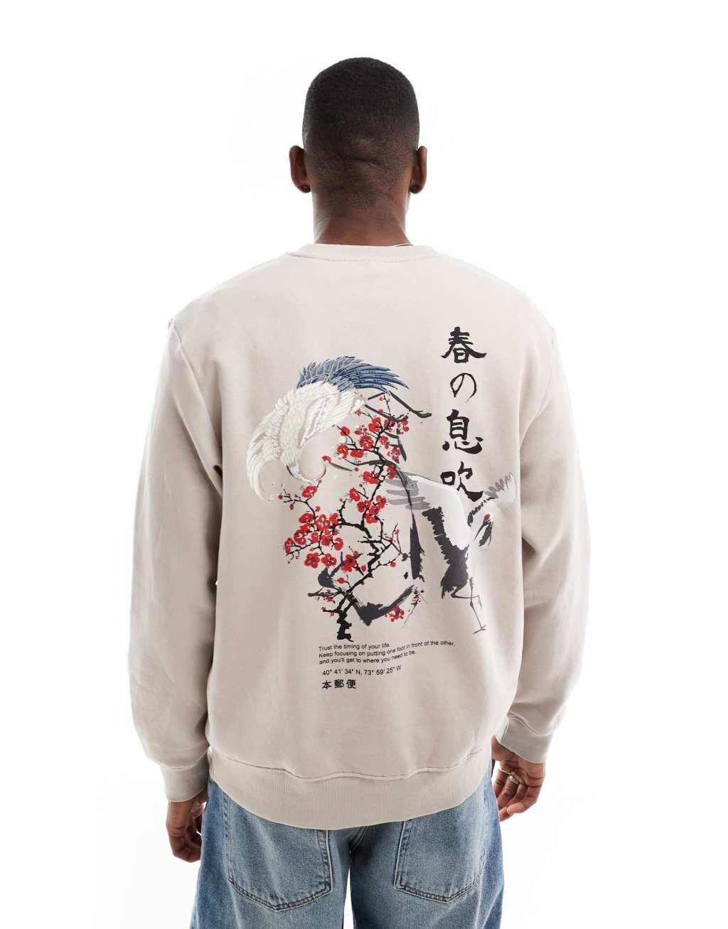 Jack & Jones oversized crew neck sweatshirt with cherry blossom back print in beige  Product Image