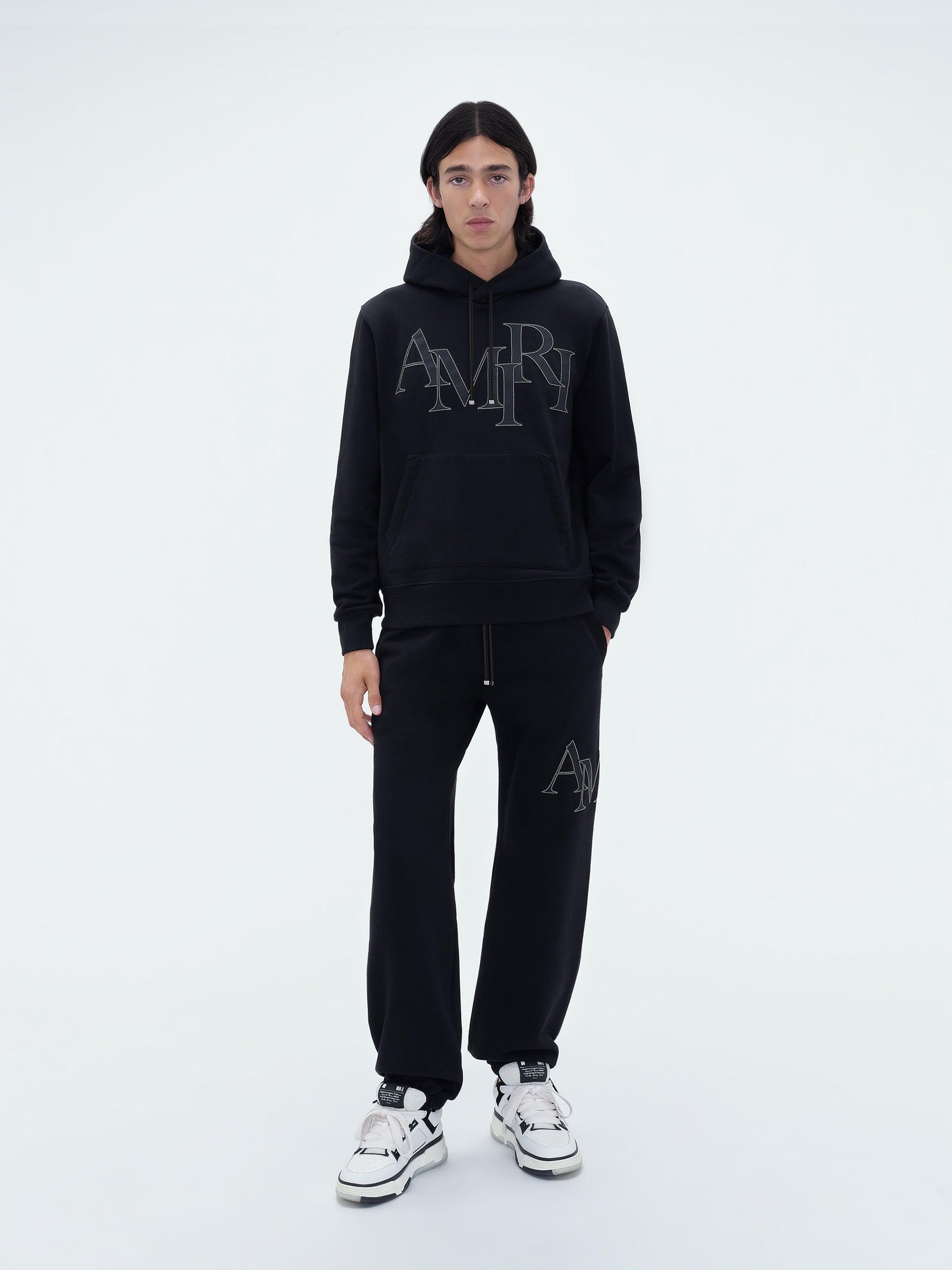 AMIRI STAGGERED LOGO HOODIE - Black Male Product Image