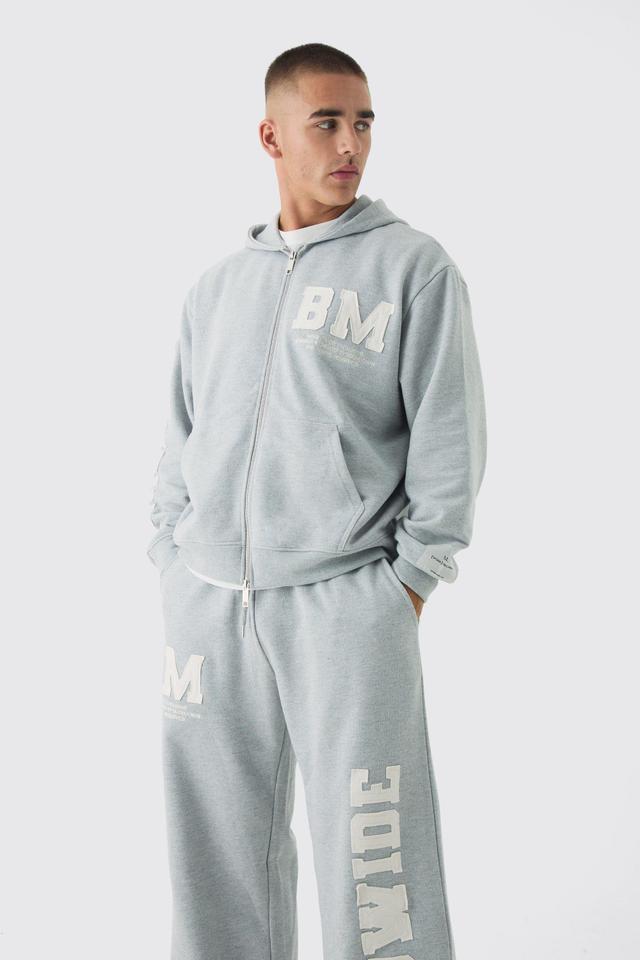 Oversized Boxy Worldwide Raw Edge Applique Zip Through Tracksuit | boohooMAN USA Product Image