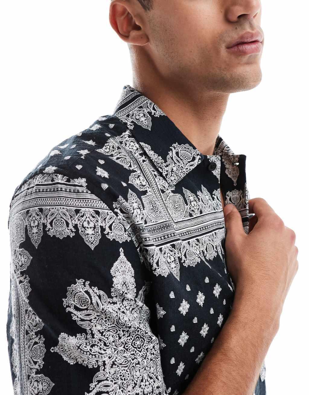 ASOS DESIGN boxy relaxed shirt in textured bandana print in black Product Image