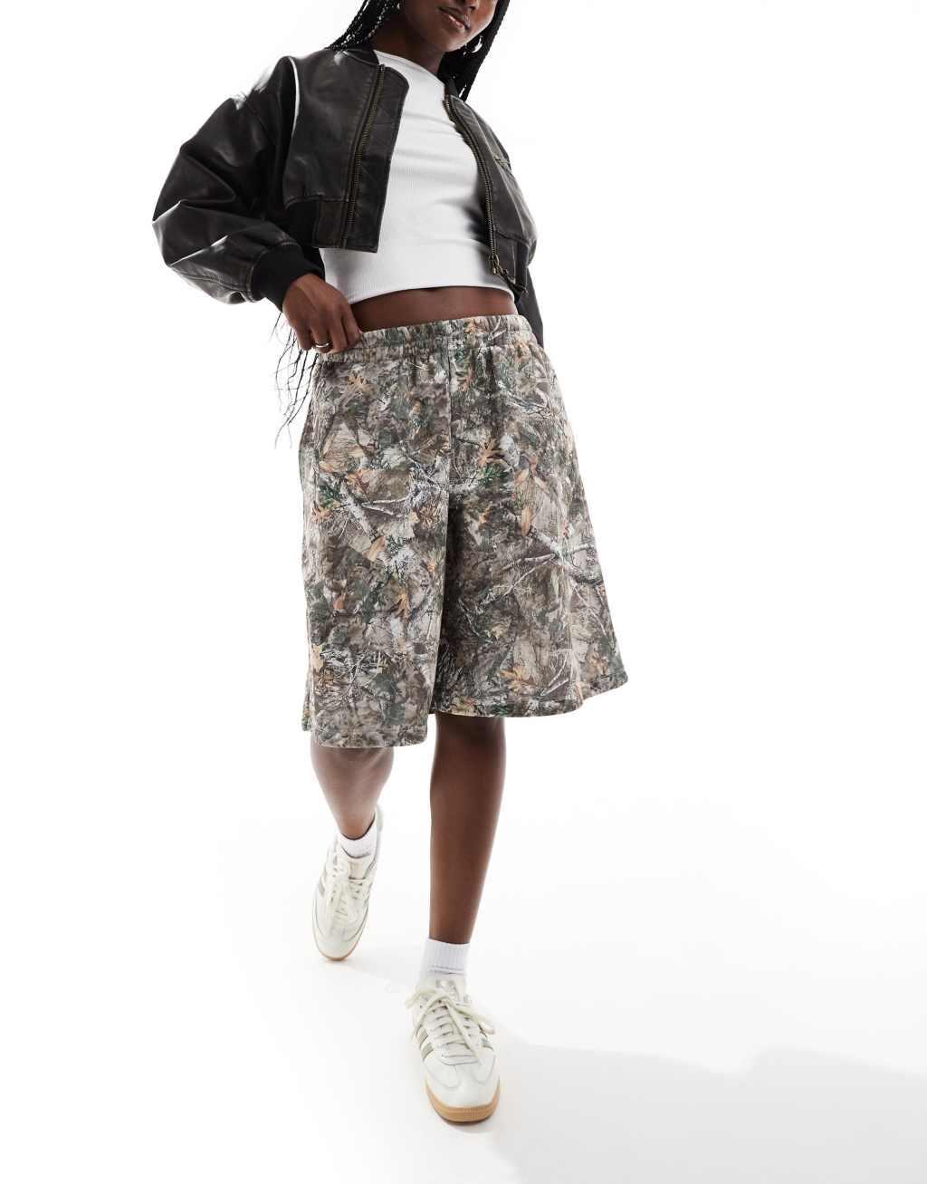 COLLUSION relaxed long sweat shorts in woodland camo Product Image