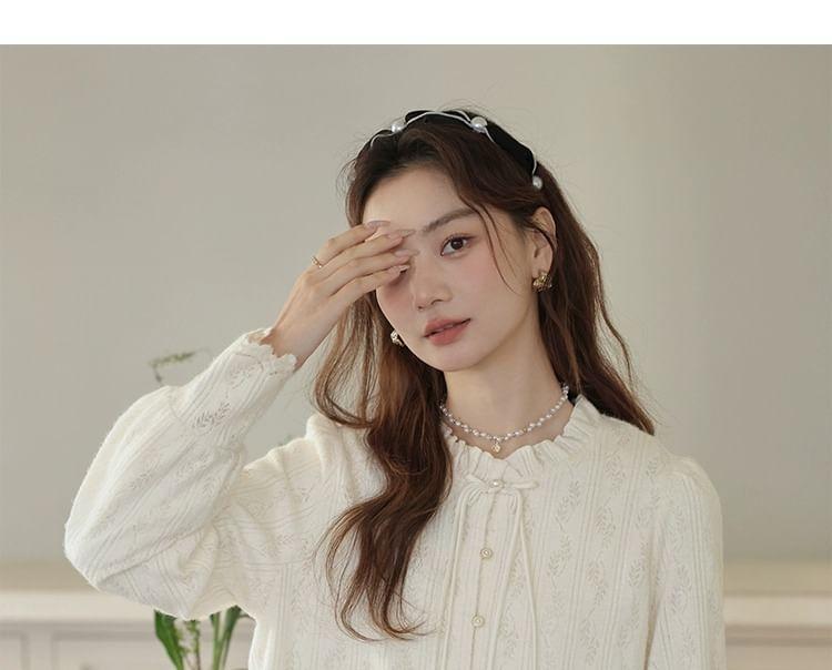 Long-Sleeve Round Neck Frill Trim Frog Button Blouse Product Image