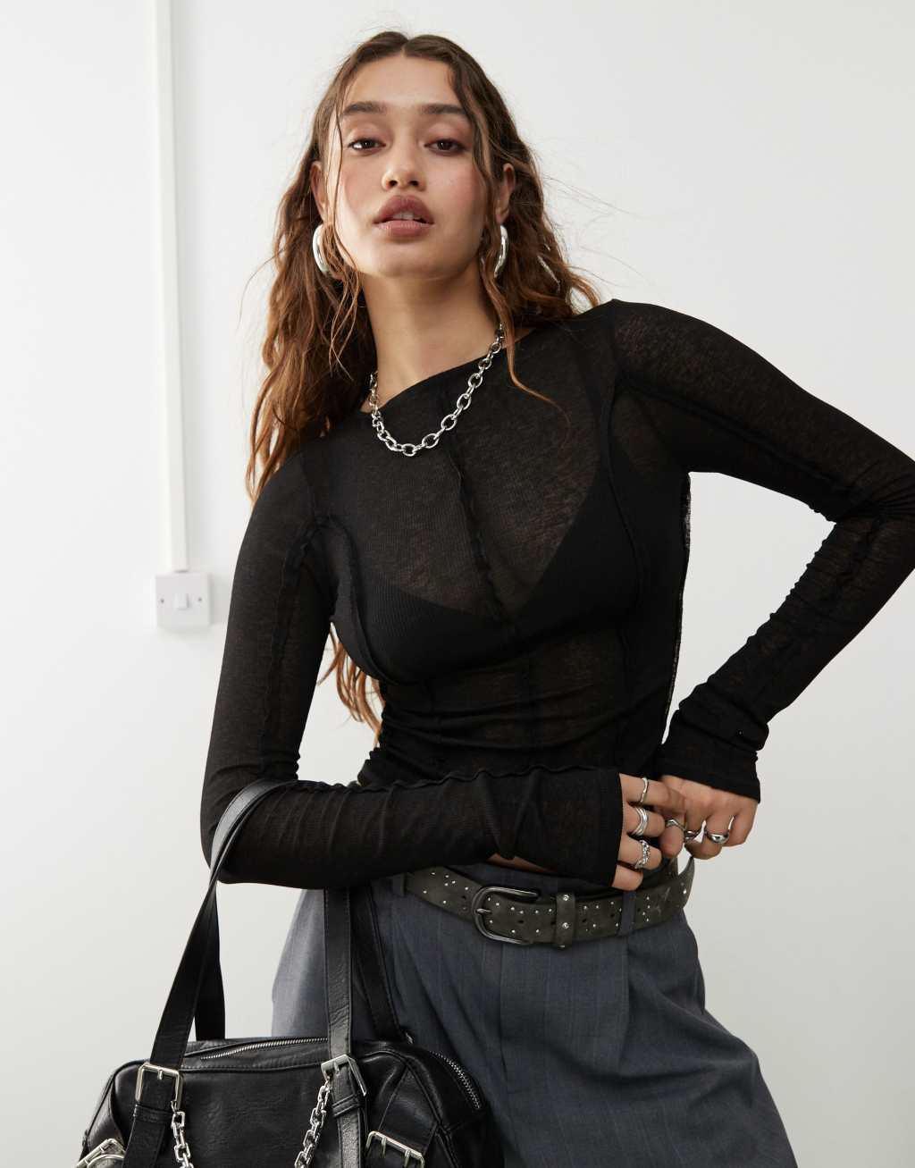 Weekday Lora semi sheer long sleeve top with reversed seams in black Product Image