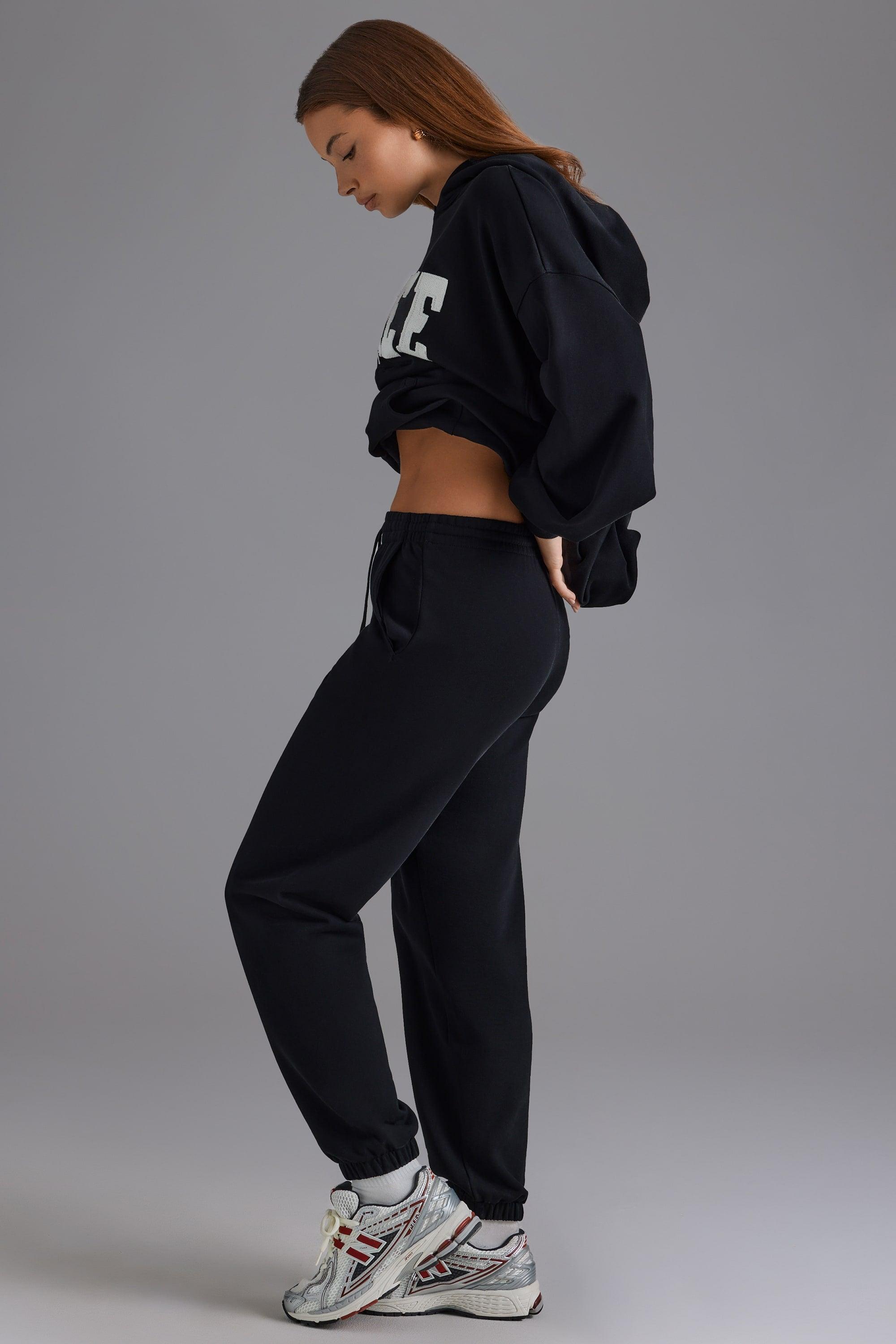 Petite Relaxed Mid-Rise Joggers in Black Product Image