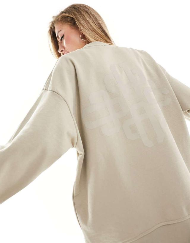 The Couture Club washed emblem sweatshirt in beige Product Image