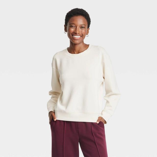 Women's Sandwash Pullover Sweatshirt - A New Day™ Cream S Product Image