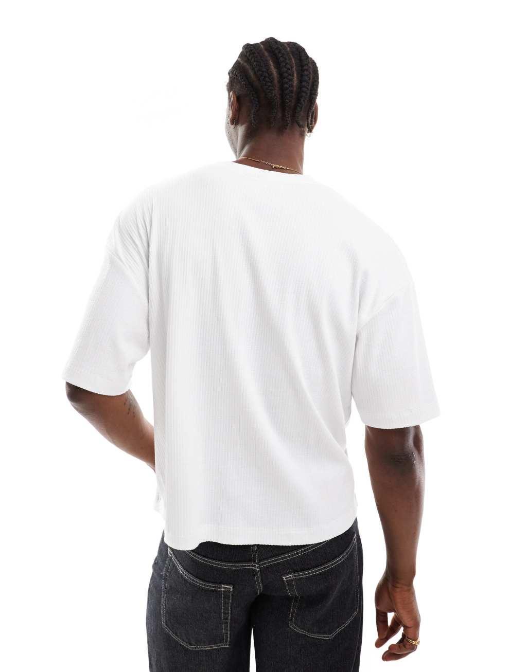 ASOS DESIGN oversized boxy ribbed T-shirt with deep cut V-neck in white Product Image