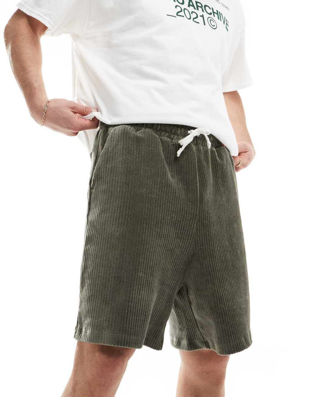 ASOS DESIGN oversized ribbed velour shorts in dark green Product Image