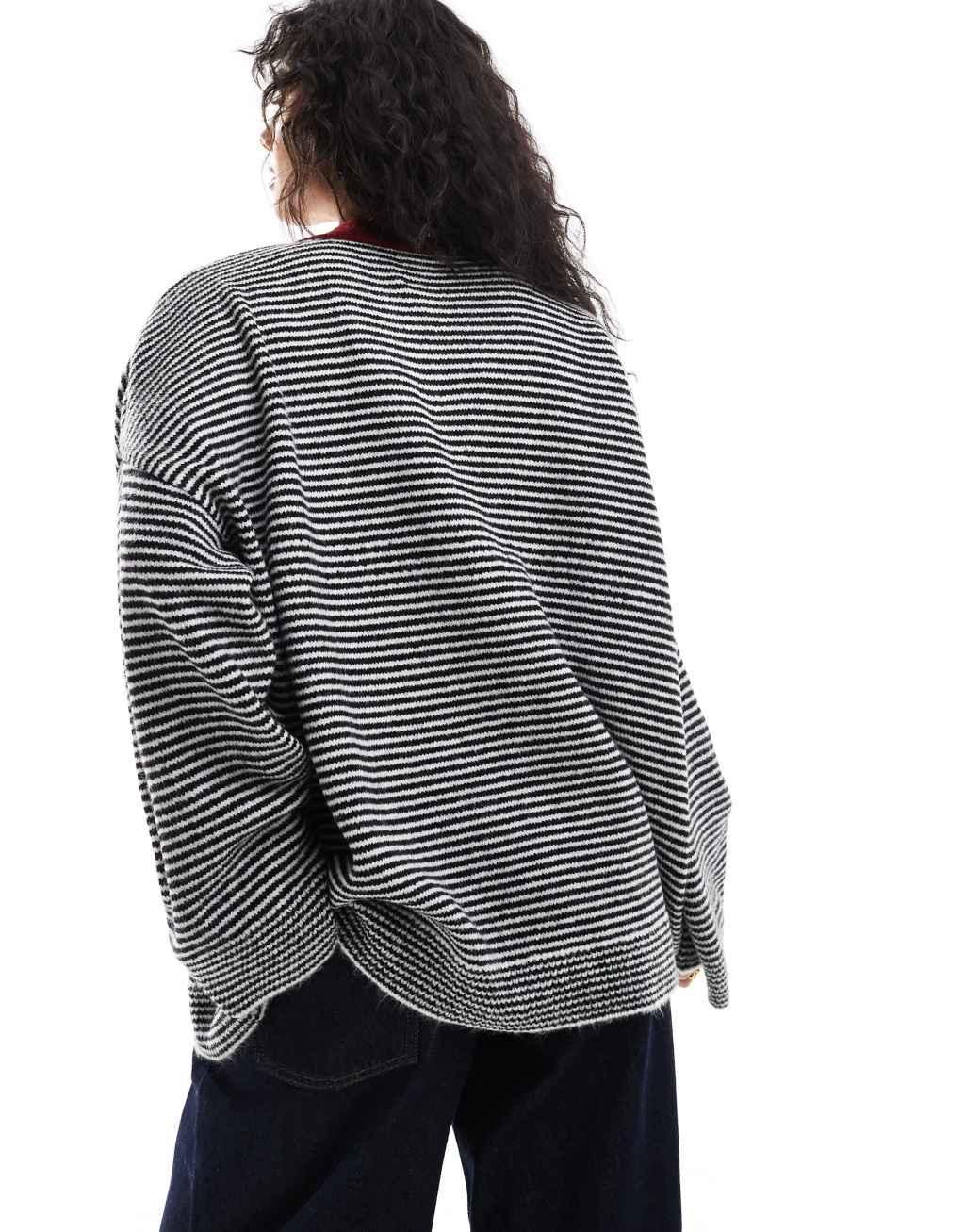 ASOS DESIGN oversized henley knit sweater in stripe with contrast placket Product Image