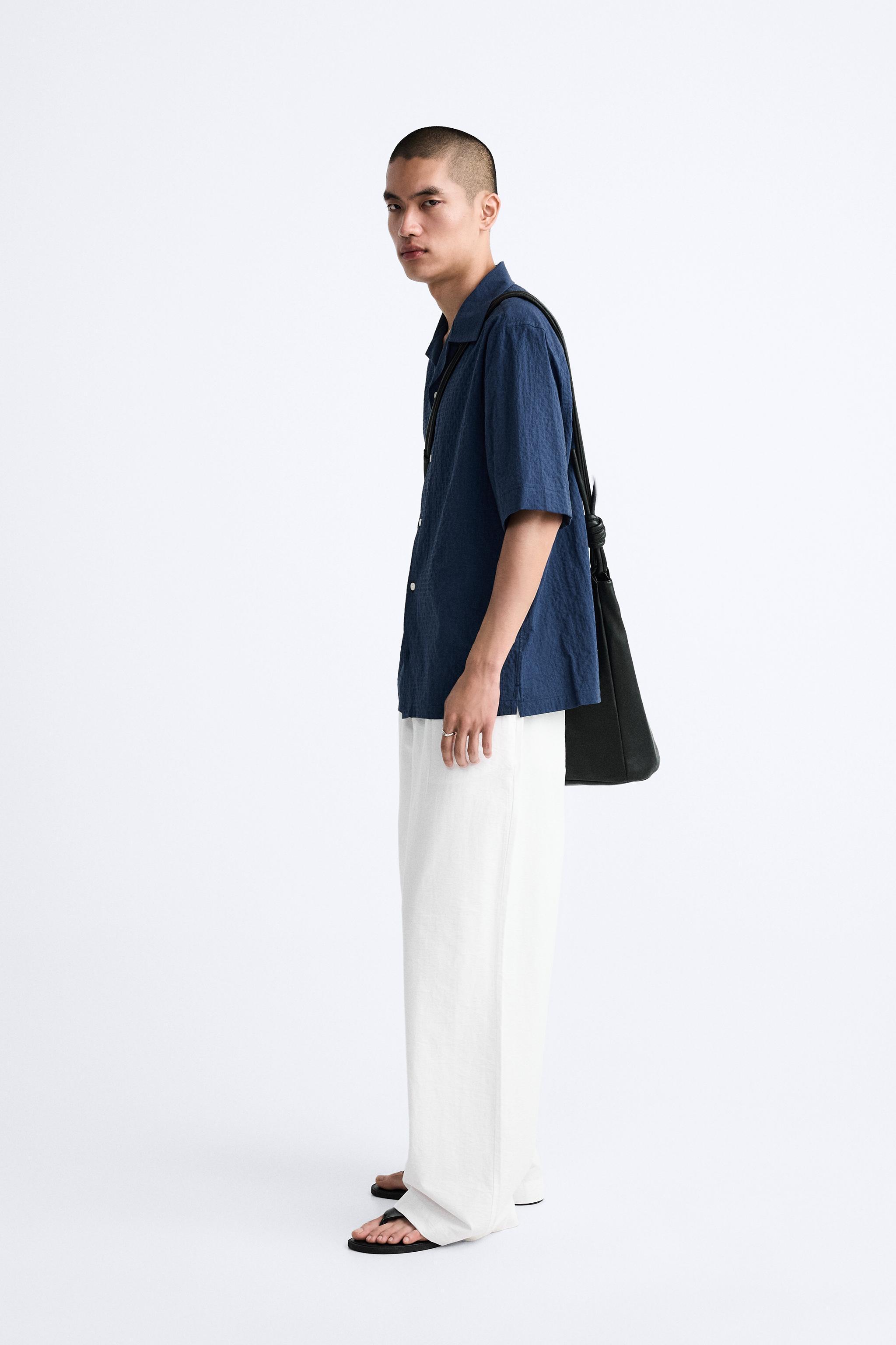 PLEATED WIDE FIT PANTS Product Image