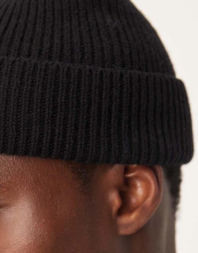 ASOS DESIGN lambswool fisherman ribbed beanie in black Product Image