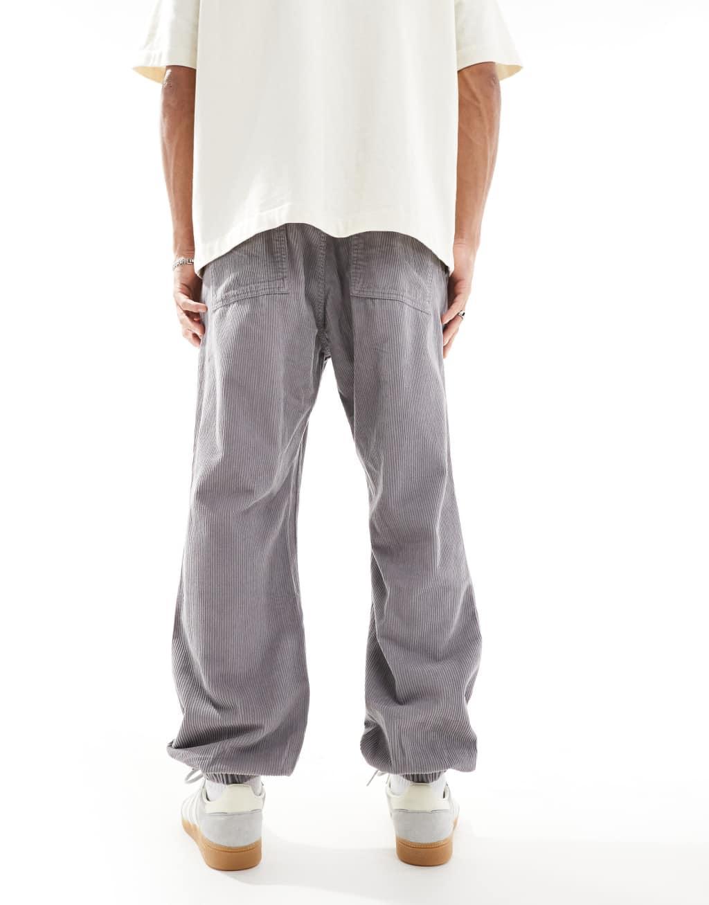 ASOS DESIGN tapered washed corduroy sweatpants in gray Product Image