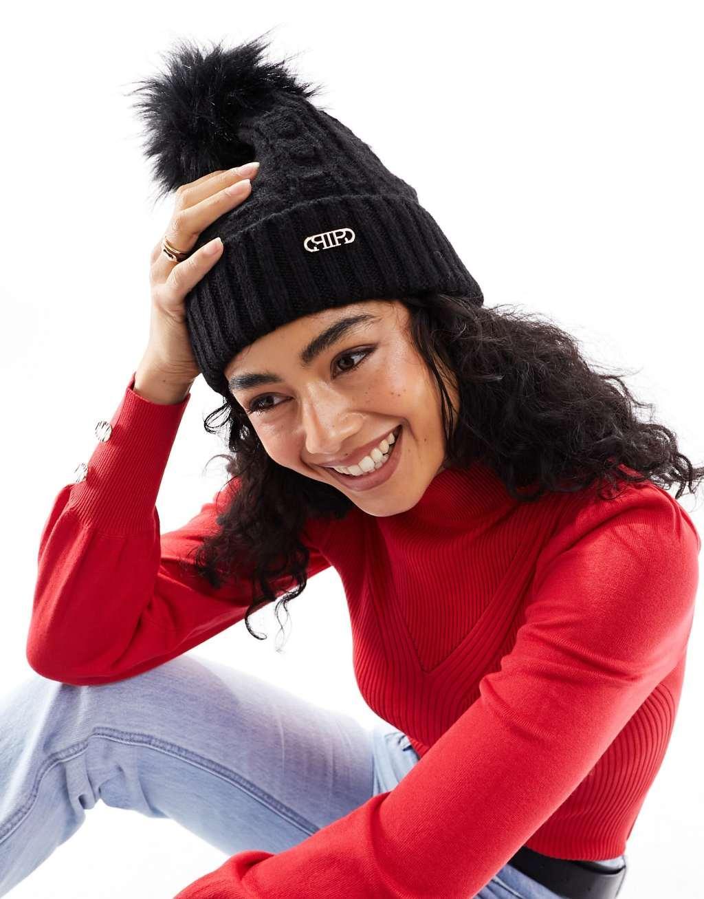 River Island cable knit pom beanie in black Product Image