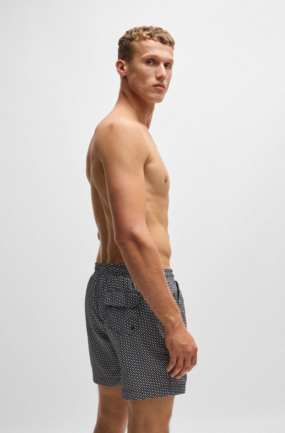 Monogram-print swim shorts in quick-dry fabric Product Image