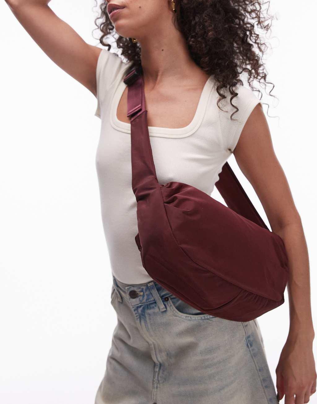 Topshop Con nylon cross body bag in burgundy Product Image