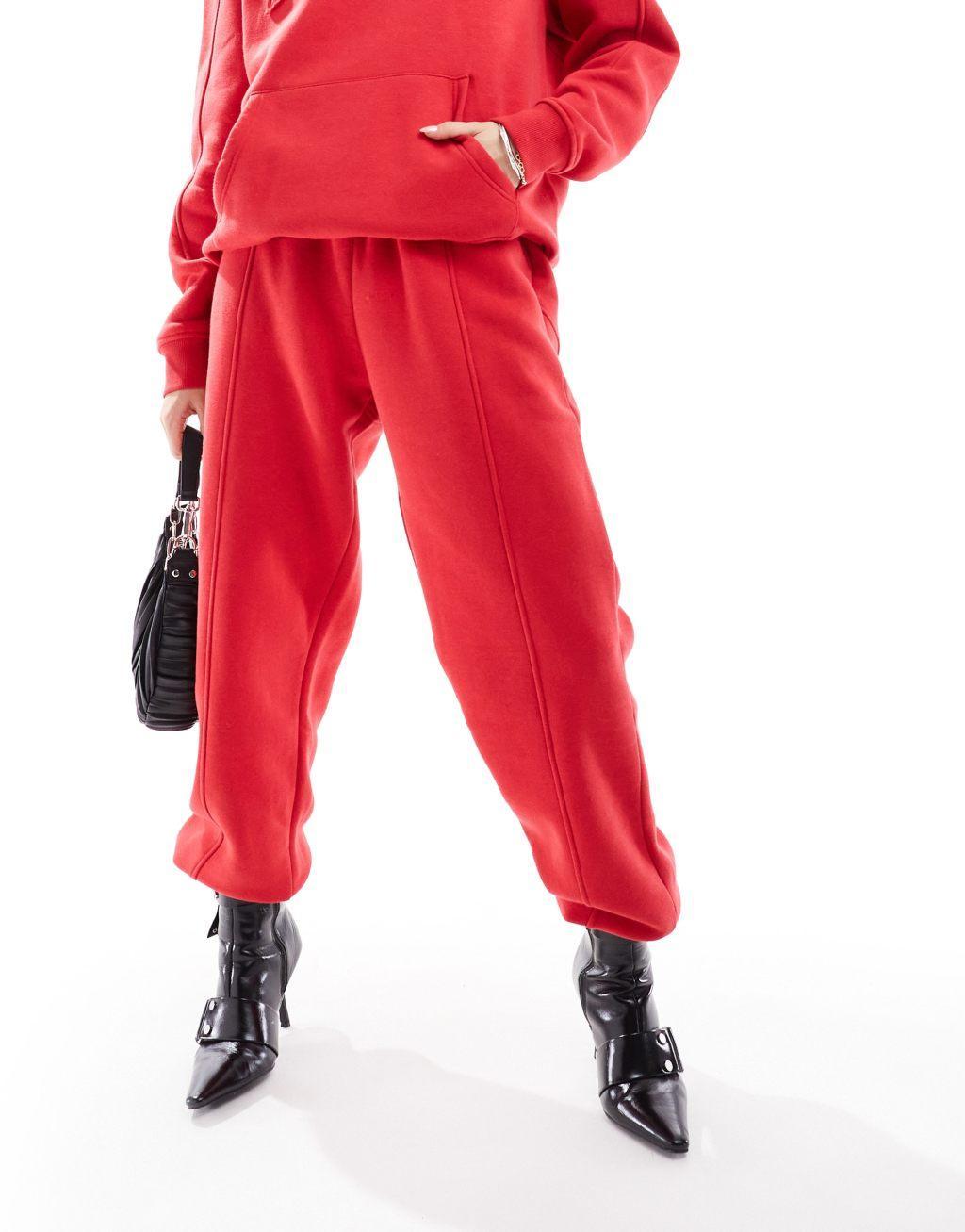 Murci exclusive saint motif sweatpants in red - part of a set Product Image