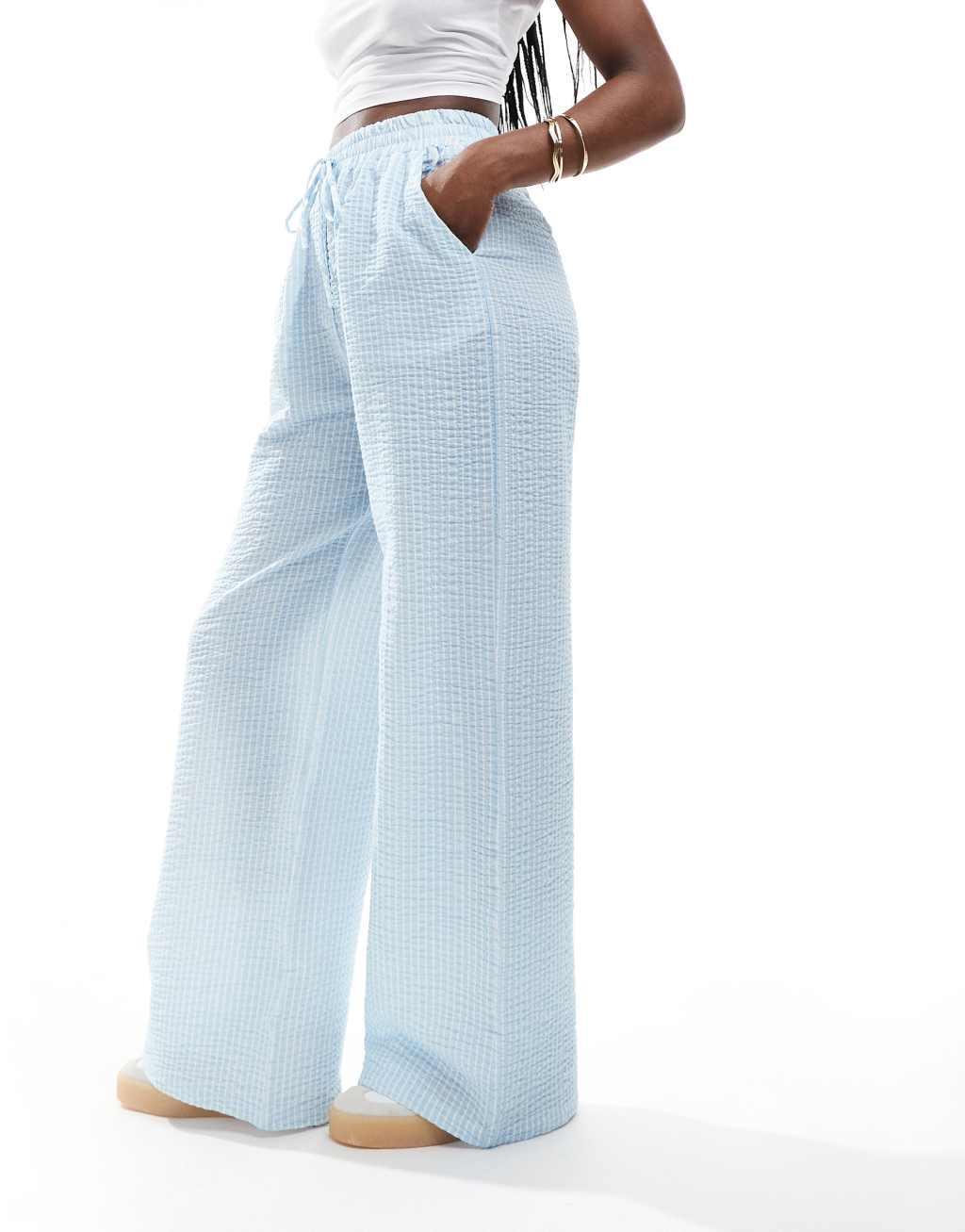 ASOS DESIGN seersucker tie waist wide leg pants in blue & white stripe Product Image