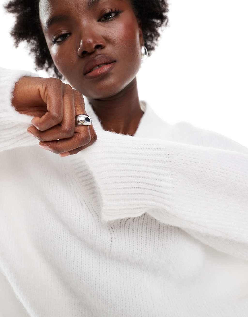 ASOS DESIGN v neck oversized sweater in fluffy yarn in cream Product Image