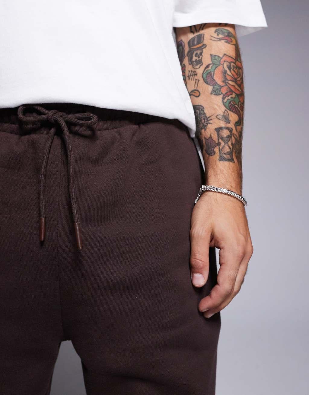 ASOS DESIGN premium heavyweight tapered sweatpants in dark brown Product Image