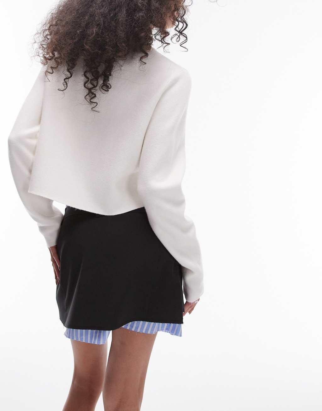 Topshop wrap over raw contrast mini skirt in black Product Image