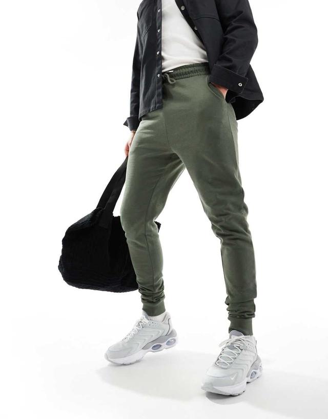 ASOS DESIGN essential skinny fit sweatpants in green Product Image