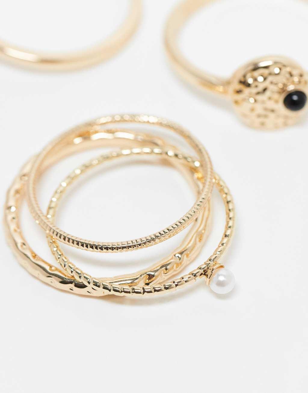 ASOS DESIGN Curve pack of 5 rings with black stone and faux pearl design in gold tone Product Image