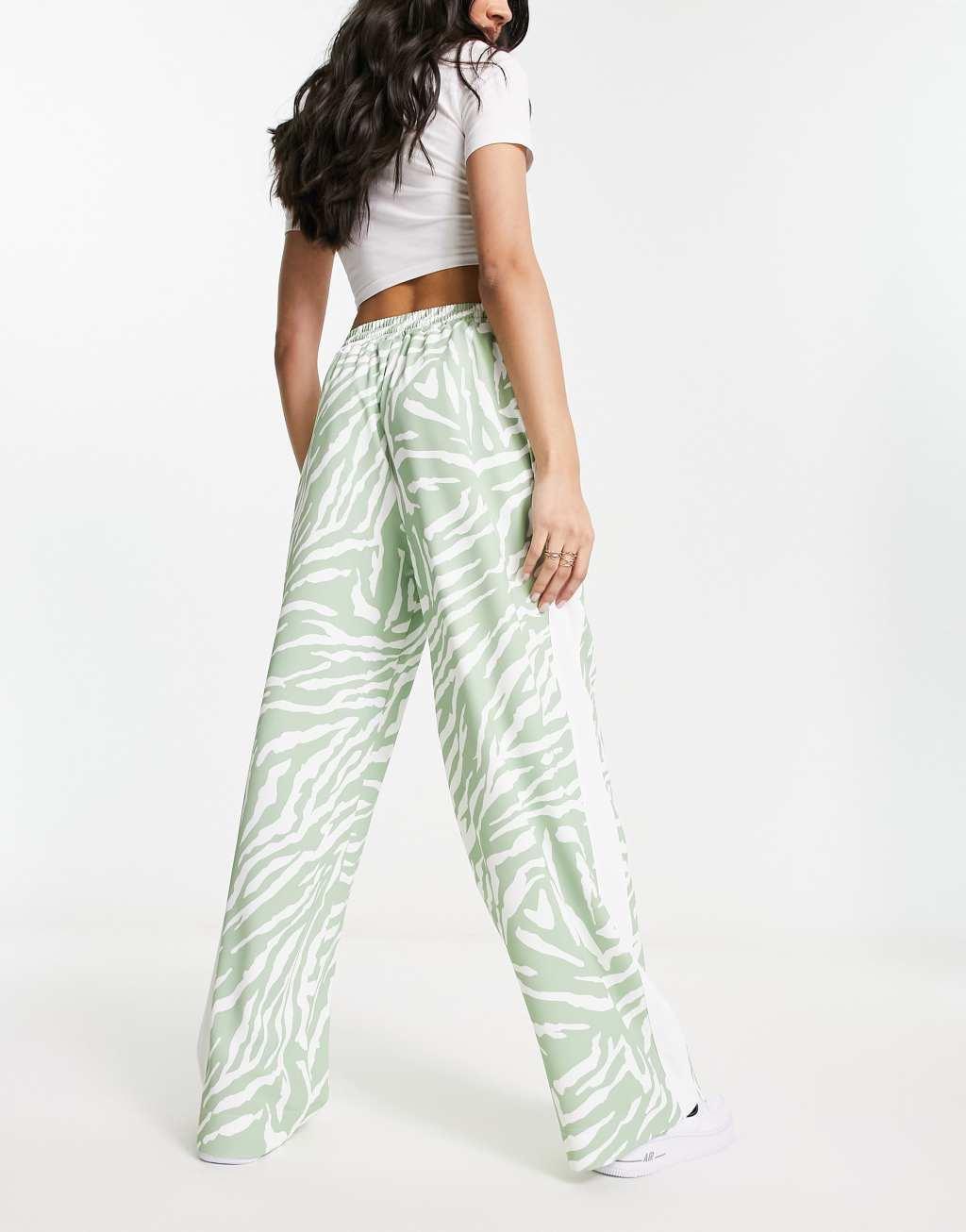 ASOS DESIGN pull on pants with contrast panel in animal print in sage  Product Image