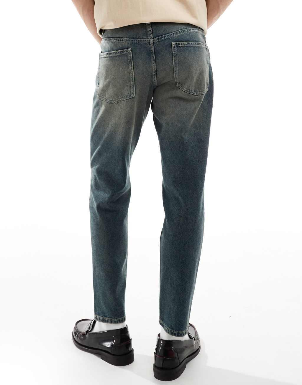 ASOS DESIGN tapered fit jeans in mid wash blue Product Image